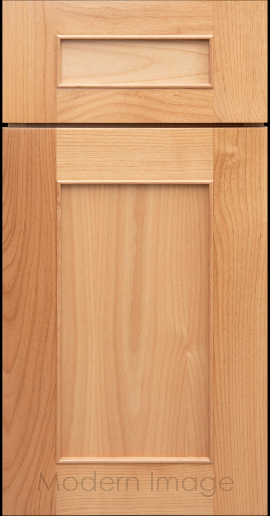 Detail view of a Chandler Shaker cabinet door in Natural stain with raised molding along the inner panel.